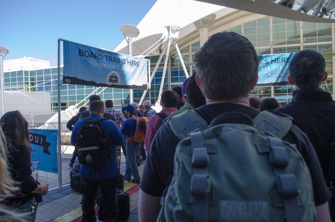 After the ceremony, the public lined up at the "BOARD TRAINS HERE" sign backed by the baby blue branding found everywhere for the #TrainToThePlane. A media run of the train had taken place earlier that morning, so they did not mingle in line with us plebs. While we waited, a band played Duke Ellington's "Take the 'A' Train."